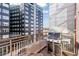 A cozy balcony featuring a grill and city views, perfect for outdoor dining and entertaining at 3100 Huron St # 4Q, Denver, CO 80202