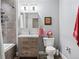 Bathroom featuring a vanity with drawers, a shower-tub combo, and a toilet at 3100 Huron St # 4Q, Denver, CO 80202