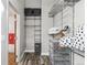 Well-organized walk-in closet featuring metal shelving, wood-look flooring, and ample space for storage at 3100 Huron St # 4Q, Denver, CO 80202