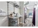 Functional walk-in closet with metal shelving, wood-look flooring, and access to the bedroom area at 3100 Huron St # 4Q, Denver, CO 80202
