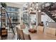 Open dining area with tall ceilings, stylish lighting, and unique bike rack at 3100 Huron St # 4Q, Denver, CO 80202