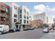 Modern apartment building showcasing contemporary design, street parking, and nearby urban landscape at 3100 Huron St # 4Q, Denver, CO 80202