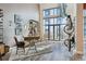 Modern home office with a view, hardwood floors, and unique bike rack at 3100 Huron St # 4Q, Denver, CO 80202