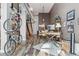 Open floor plan with home office, dining, hardwood floors and modern staircase at 3100 Huron St # 4Q, Denver, CO 80202