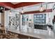 Open-concept living area featuring a modern kitchen and a large window view at 3100 Huron St # 4Q, Denver, CO 80202