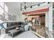 Open-concept living room with high ceilings, exposed beams, and modern design at 3100 Huron St # 4Q, Denver, CO 80202