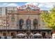 Historic Union Station facade with 'Travel by Train' signage, clock, and pedestrian activity at 3100 Huron St # 4Q, Denver, CO 80202
