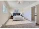 Cozy bedroom features neutral walls, carpeted floor, and a comfortable queen-sized bed at 9263 E Nassau Ave, Denver, CO 80237