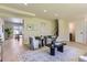 Inviting living area showcasing stylish furniture and an open layout to the dining space at 9263 E Nassau Ave, Denver, CO 80237