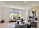 Cozy living room with modern decor, wood accent wall, and ample natural light at 9263 E Nassau Ave, Denver, CO 80237