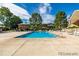 Community swimming pool with lounge chairs for residents enjoyment at 9263 E Nassau Ave, Denver, CO 80237