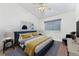 Bright bedroom featuring decor, ceiling fan, soft carpet, and a window with natural light at 4195 W 111Th Cir, Westminster, CO 80031