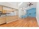 Spacious living room with hardwood floors, kitchen view and skylight at 4195 W 111Th Cir, Westminster, CO 80031