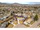 Aerial view displays the home, fenced yard and mountain views in a well-established neighborhood at 4653 S Yank St, Morrison, CO 80465