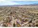 Overhead view of the home with mountain views featuring the fenced yard in a quiet neighborhood at 4653 S Yank St, Morrison, CO 80465