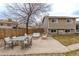 Relaxing backyard patio features a table set and a comfortable seating area perfect for outdoor enjoyment at 4653 S Yank St, Morrison, CO 80465