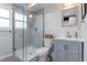 This bathroom features a modern glass-enclosed shower, a toilet, and a vanity with a sink at 4653 S Yank St, Morrison, CO 80465