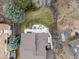 Aerial view of a home showing backyard patio with furniture, landscaping, mature trees, and overall lot layout at 1123 E 132Nd Way, Thornton, CO 80241