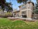 Back of house with large patio, outdoor seating and bbq grills at 1123 E 132Nd Way, Thornton, CO 80241