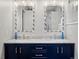 Beautifully updated bathroom featuring double sinks with stone countertops and ornate mirrors at 1123 E 132Nd Way, Thornton, CO 80241