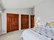 Spacious bedroom featuring three large closets and comfortable bedding for relaxation and storage at 1123 E 132Nd Way, Thornton, CO 80241