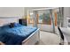 Comfortable bedroom with a bay window that lets in plenty of natural light at 1123 E 132Nd Way, Thornton, CO 80241