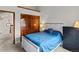 Well-lit bedroom features a large closet and rustic wooden accents, creating a cozy atmosphere at 1123 E 132Nd Way, Thornton, CO 80241