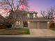 Charming two-story home featuring a welcoming front porch and a two car garage at 1123 E 132Nd Way, Thornton, CO 80241