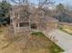 Aerial view of a home with a well-maintained lawn, mature trees, and an attached two car garage at 1123 E 132Nd Way, Thornton, CO 80241