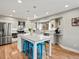 Bright kitchen with stainless steel appliances, granite countertops, large island and hardwood floors at 1123 E 132Nd Way, Thornton, CO 80241