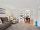Open living space showcasing a seamless transition to the dining area and kitchen, perfect for modern living and entertaining at 1123 E 132Nd Way, Thornton, CO 80241