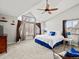Bright main bedroom featuring vaulted ceiling, large windows, ceiling fan and ensuite access at 1123 E 132Nd Way, Thornton, CO 80241