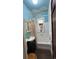 Charming bathroom with a classic tub, white tiled walls, and a painted cloudscape ceiling, creating a serene and inviting atmosphere at 2320 22Nd St, Boulder, CO 80304