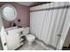 Modern bathroom features a white vanity, a round mirror and a shower area with curtain at 2320 22Nd St, Boulder, CO 80304
