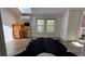 Bright bedroom with a skylight, wooden floors, and a computer on a desk, all underneath a skylight at 2320 22Nd St, Boulder, CO 80304