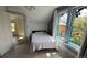 Bedroom showcasing natural light, a comfortable bed, and a view of lush trees, creating a peaceful retreat at 2320 22Nd St, Boulder, CO 80304