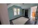 Light blue painted bedroom featuring a white area rug, hardwood floors, and two windows at 2320 22Nd St, Boulder, CO 80304