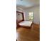 Bedroom featuring a Murphy bed, wood floors, and bright natural light at 2320 22Nd St, Boulder, CO 80304