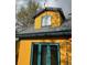 Exterior view of a two-story home featuring a charming yellow facade and stylish window design at 2320 22Nd St, Boulder, CO 80304