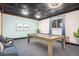 Finished basement featuring a pool table, modern lighting, and decor for entertainment at 14753 E Alabama Pl, Aurora, CO 80012