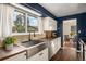 Bright eat-in kitchen with a stainless steel sink, wood floors and stainless steel appliances at 14753 E Alabama Pl, Aurora, CO 80012