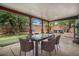 Covered patio with outdoor dining area and a hot tub, perfect for entertaining at 14753 E Alabama Pl, Aurora, CO 80012