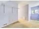 This bedroom has a unique built-in closet system, and a light-filled window with a neutral carpet at 2285 N Monaco Pkwy, Denver, CO 80207