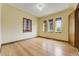 Bright bedroom with hardwood floors, multiple windows, and classic charm at 2285 N Monaco Pkwy, Denver, CO 80207