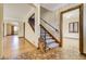 Entryway with tiled floor and staircase with access to living room at 2285 N Monaco Pkwy, Denver, CO 80207