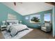 Bright bedroom with vaulted ceilings, a plush bed, and multiple windows offering scenic views at 457 Buena Vista Rd, Golden, CO 80401