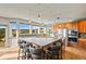 Open-concept kitchen features a large center island with seating and stainless-steel appliances at 457 Buena Vista Rd, Golden, CO 80401