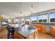 Spacious kitchen boasts an oversized island, stainless steel appliances, and scenic mountain views at 457 Buena Vista Rd, Golden, CO 80401