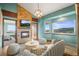 Inviting living room with stone fireplace, stylish furniture, and picturesque mountain views at 457 Buena Vista Rd, Golden, CO 80401