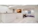 Finished basement with wet bar, carpet, and an archway to another room at 7420 S Houstoun Waring Cir, Littleton, CO 80120